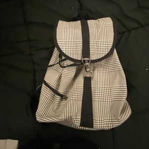 Black and white drawstring backpack